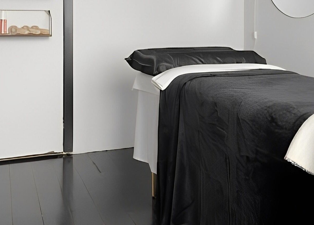 Elegant treatment room at StudioEDIT, Kawakawa, Northland, NZ with black and white decor.