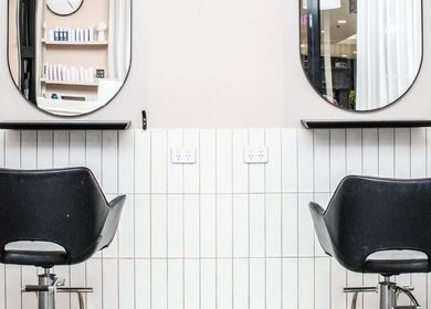 Lux Hair Lounge salon chairs and mirrors, Narellan, New South Wales, AU. Sleek, modern styling.