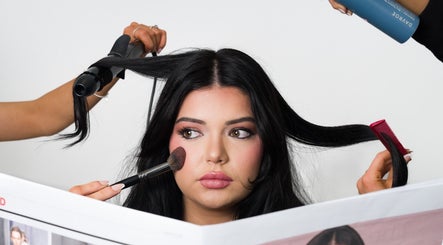 Lux Hair Lounge stylists in Narellan, New South Wales, AU, creating a chic hairstyle and makeup look.