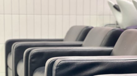 Comfortable seating at Lux Hair Lounge, Narellan, New South Wales, AU. Modern and inviting salon atmosphere.