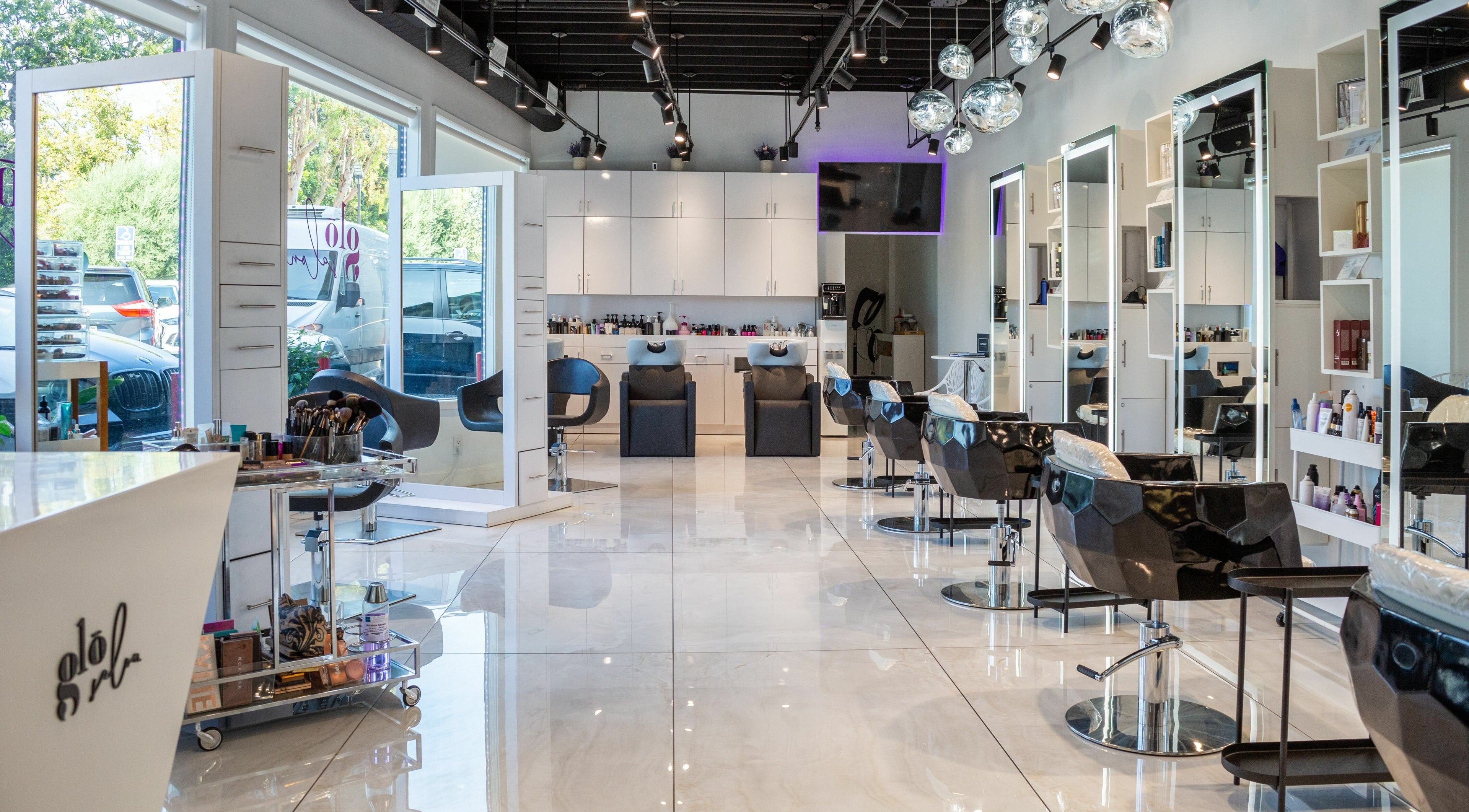 Modern interior of Salon Glo in Los Angeles, California, US, featuring stylish chairs and contemporary decor.