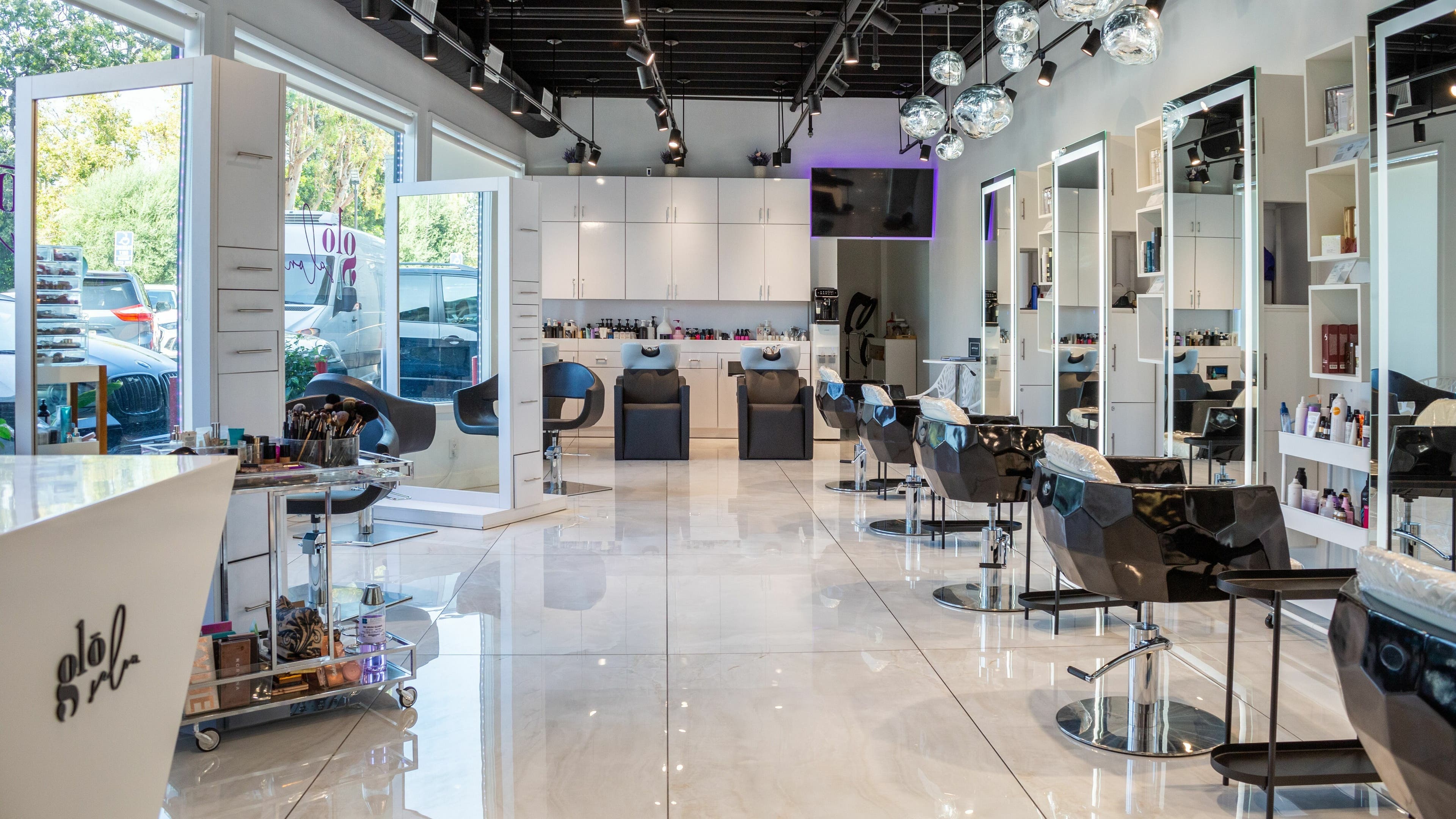 Modern interior of Salon Glo in Los Angeles, California, US, featuring stylish chairs and contemporary decor.