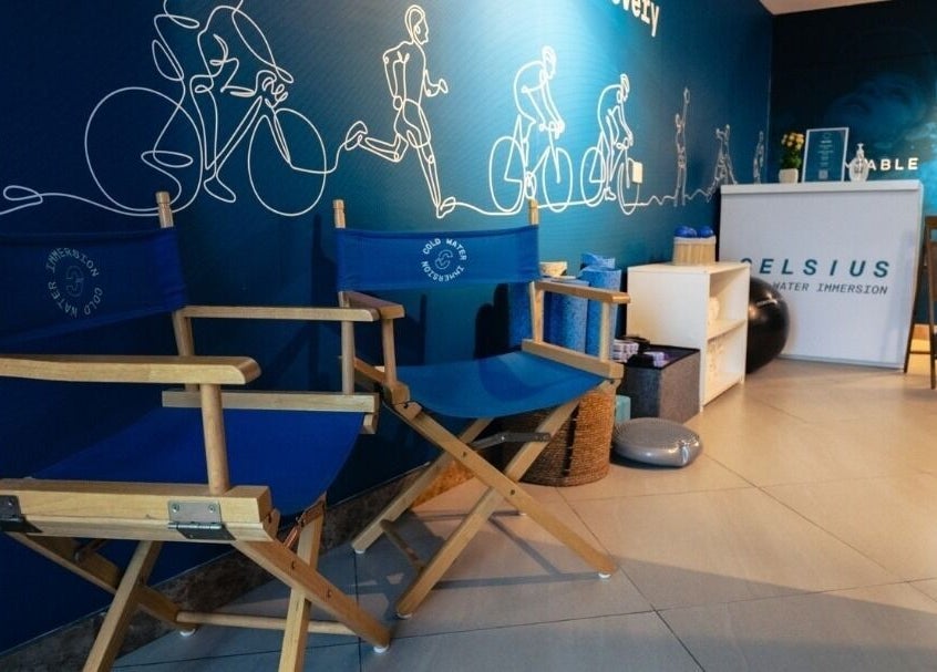 Relaxing chairs at Celsius Cold Water Immersion, Abu Dhabi, AE, with exercise-themed decor.