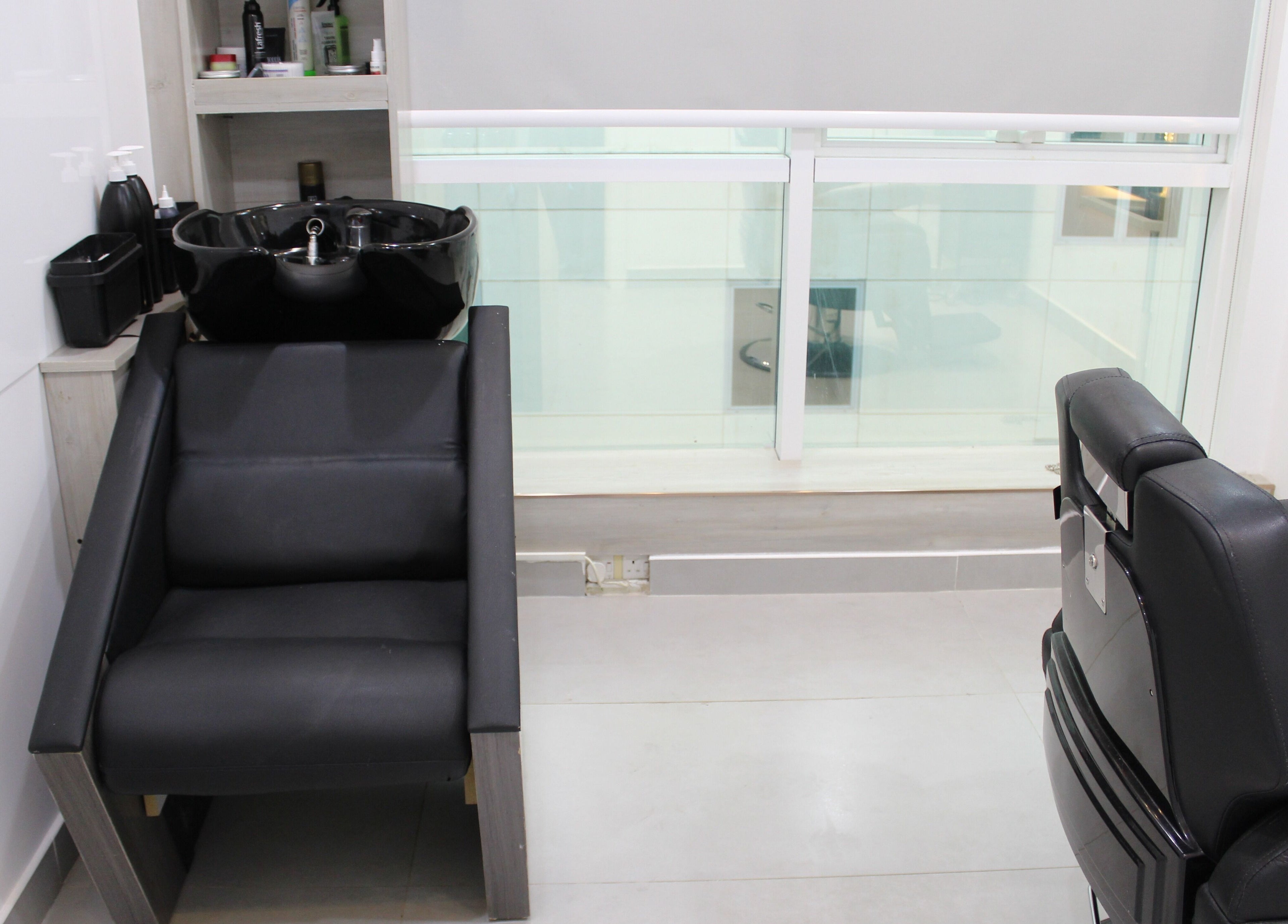 Modern salon interior with black chairs at New Images, Dubai, 127825, AE.