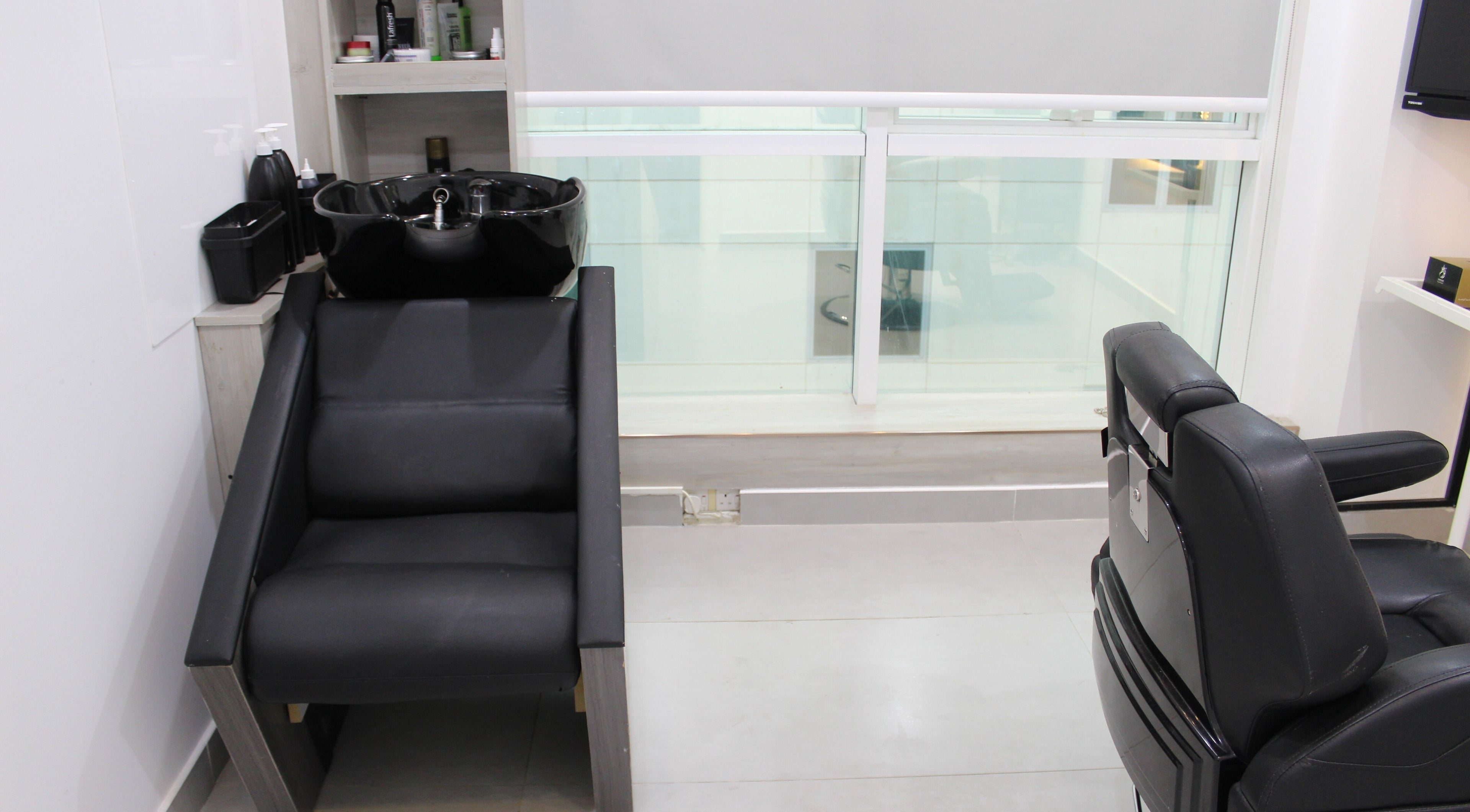 Modern salon interior with black chairs at New Images, Dubai, 127825, AE.