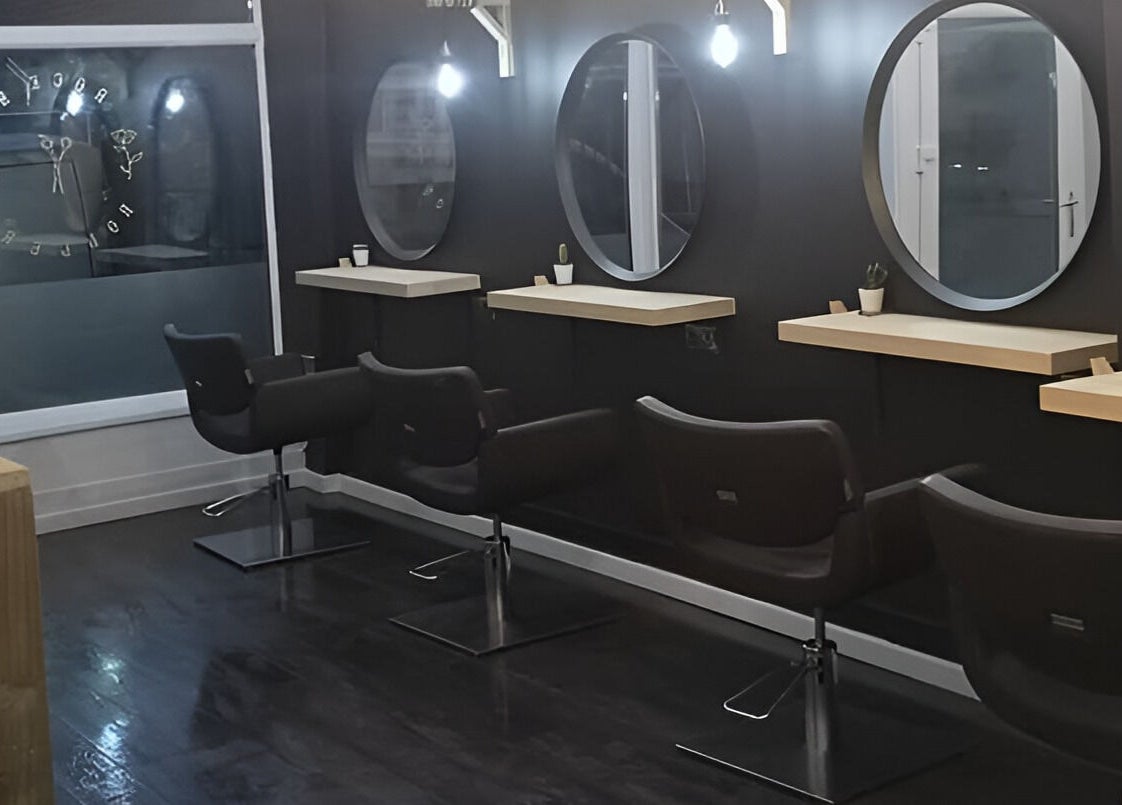 Modern salon chairs and mirrors at Rock N Rollers, Cwmfields, Wales, GB, showcasing stylish design.