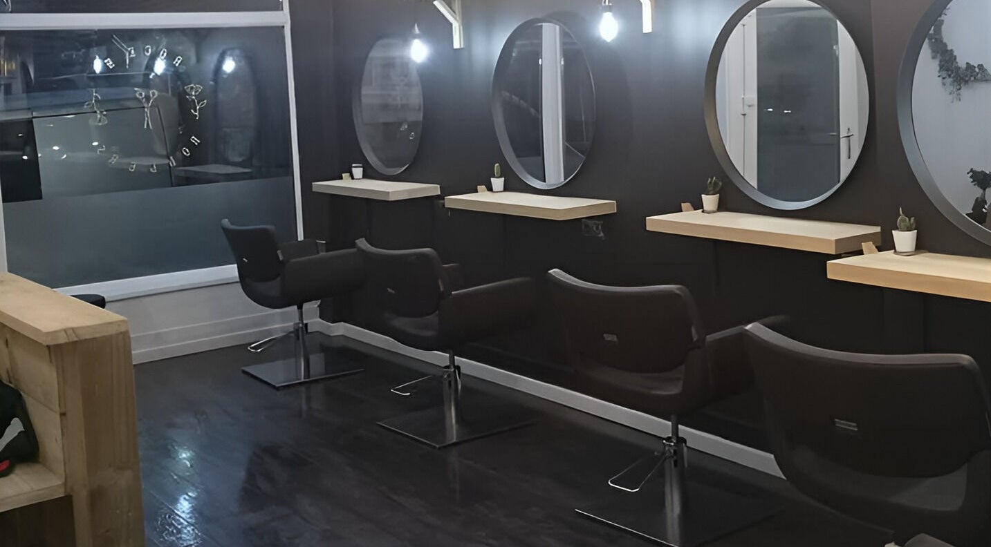 Modern salon chairs and mirrors at Rock N Rollers, Cwmfields, Wales, GB, showcasing stylish design.