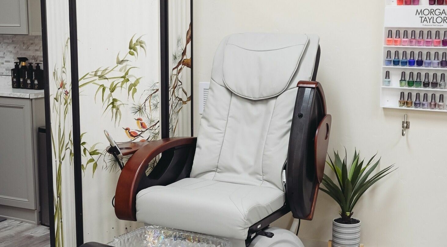 Elegant pedicure station at A Borgata Salon in Prescott, Arizona, US with comfortable chair and nail polish display.