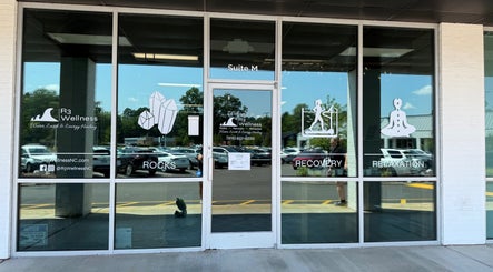 Front view of R3 Wellness in Durham, North Carolina, US, showcasing rocks, recovery, and relaxation services.