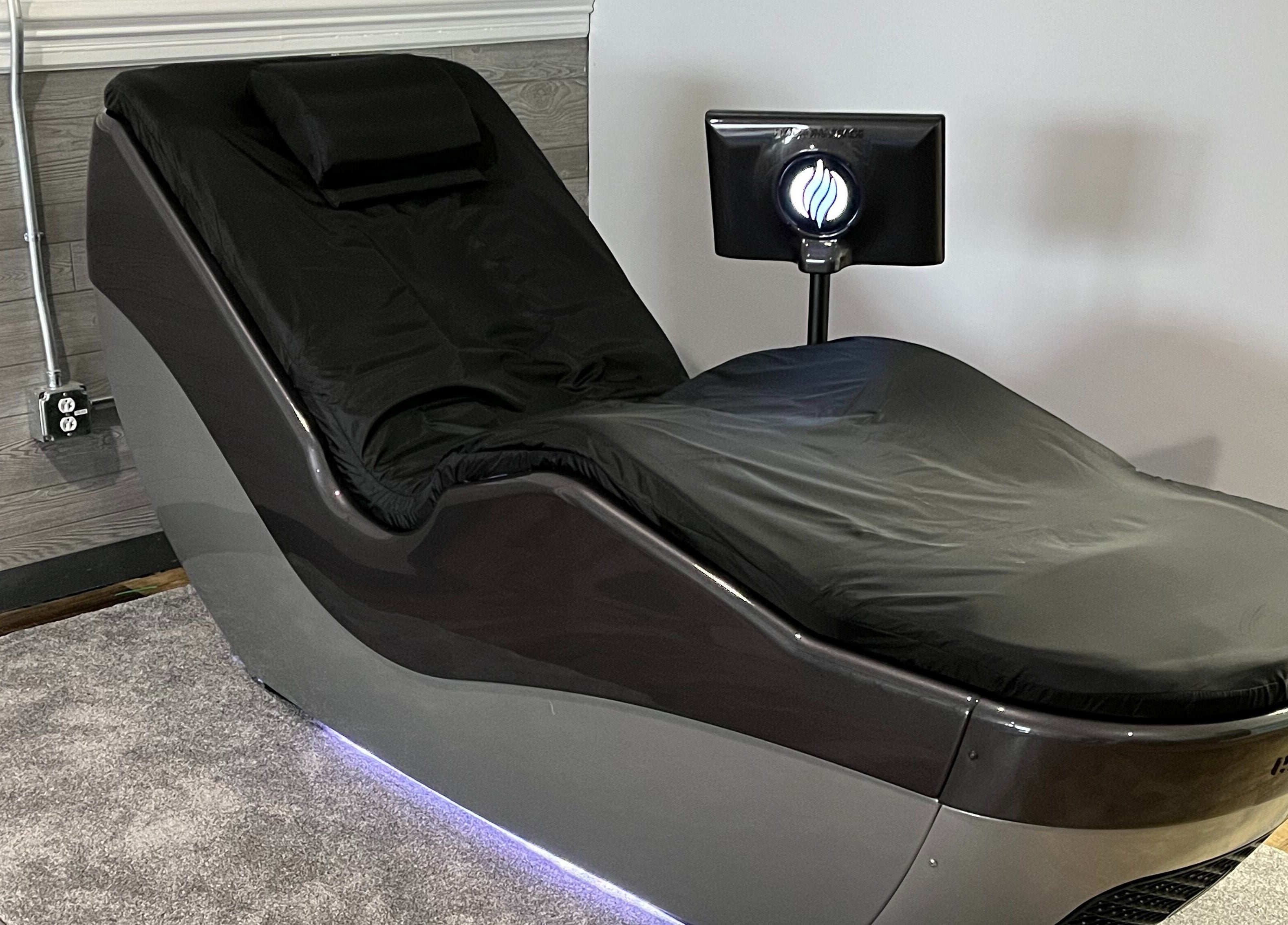 Massage chair at R3 Wellness in Durham, North Carolina, US offers luxury relaxation and rejuvenation.