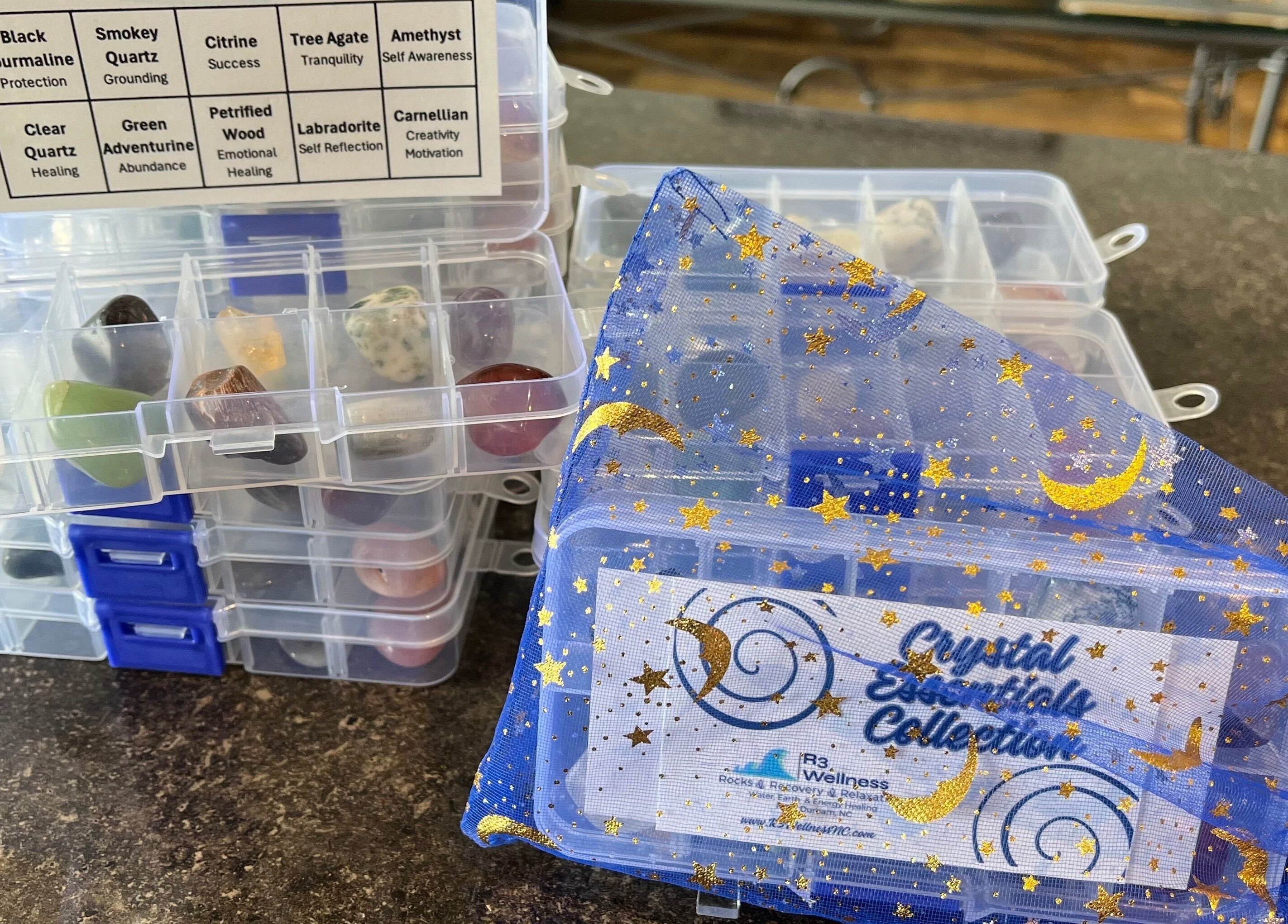 Crystal collection at R3 Wellness, Durham, North Carolina, US, showcasing healing stones in a decorative bag.