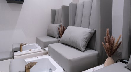 Luxurious pedicure lounge at Abby Nails Leyton in London, England, GB with plush seating and opulent decor.