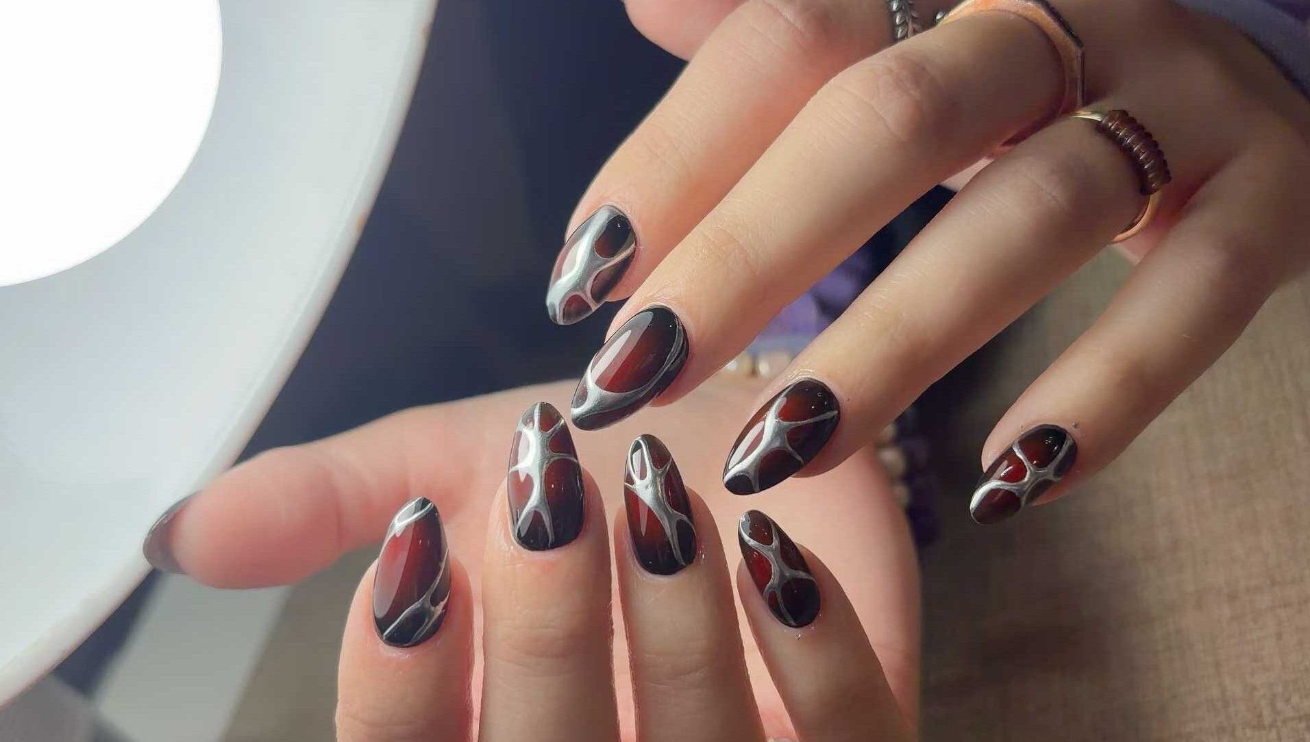 Chic nail art design at Abby Nails Finsbury Park, London, England, GB, showcasing intricate patterns.