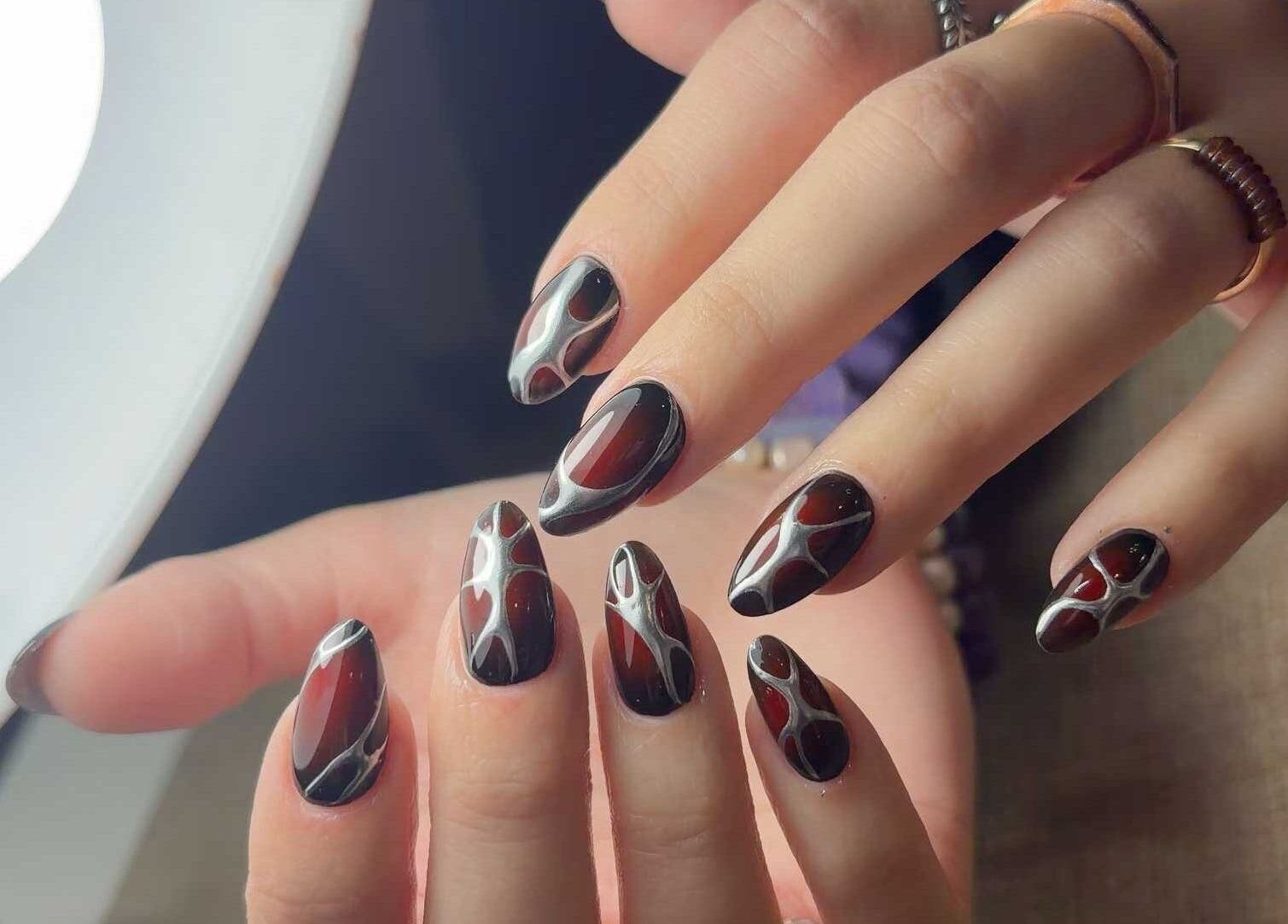 Chic nail art design at Abby Nails Finsbury Park, London, England, GB, showcasing intricate patterns.