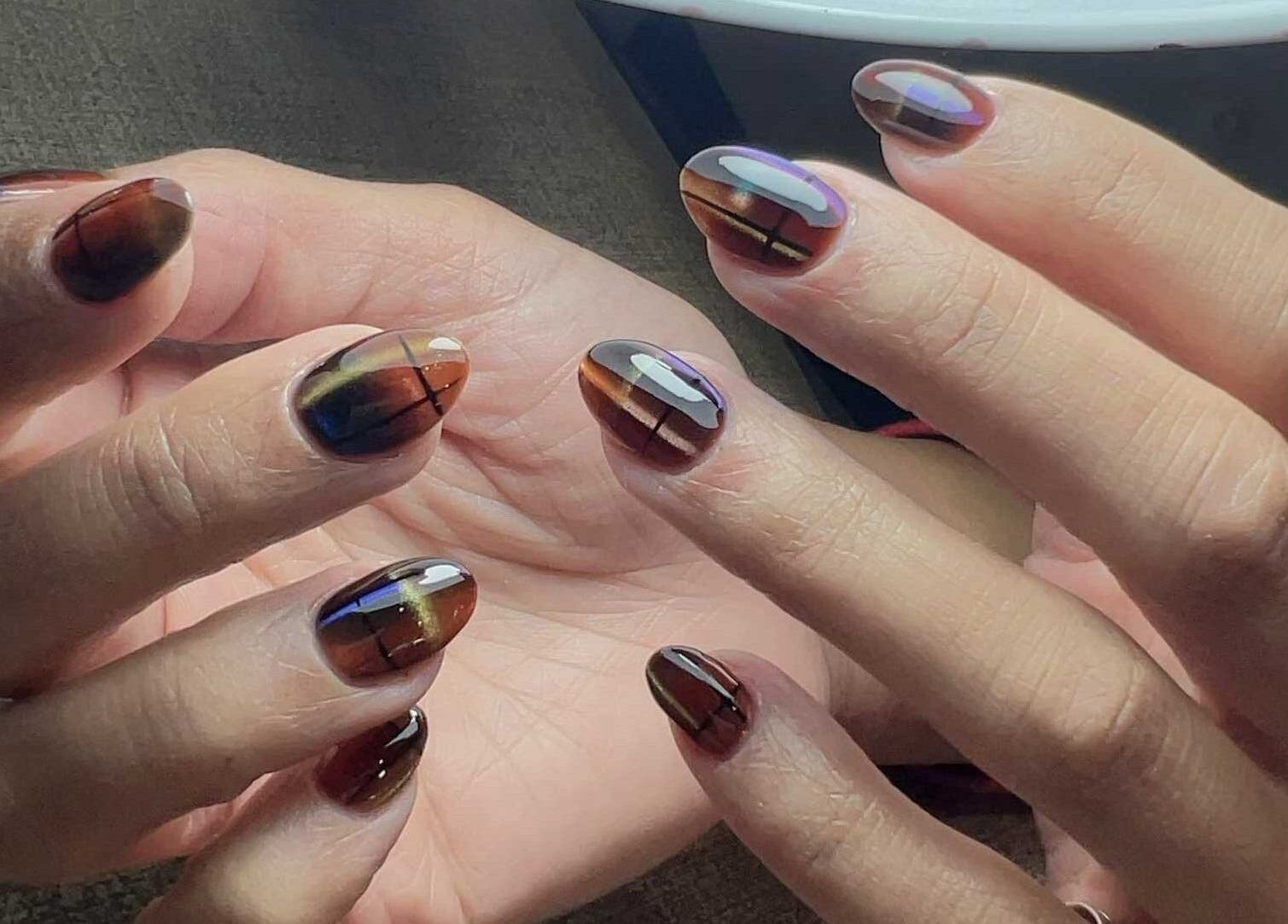 Elegant nail art at Abby Nails Finsbury Park, London, England, GB showcasing intricate, multi-colored designs.