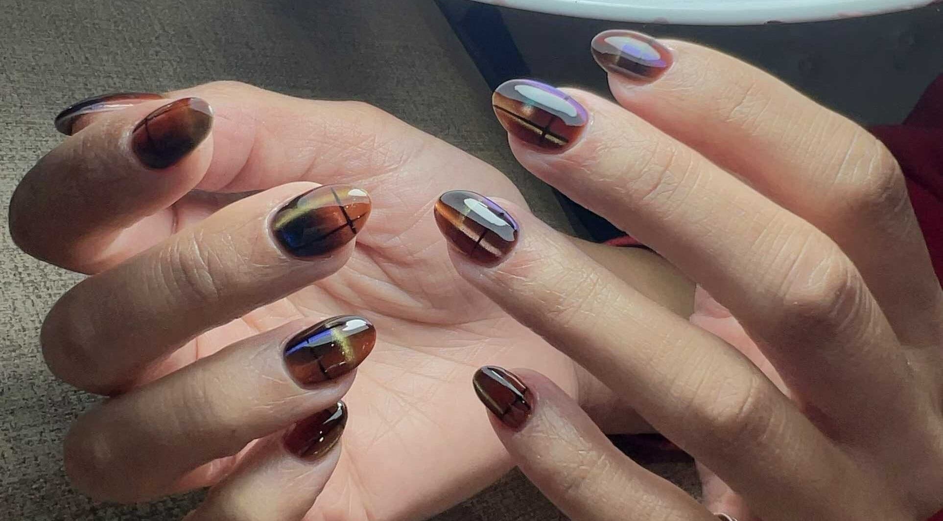 Elegant nail art at Abby Nails Finsbury Park, London, England, GB showcasing intricate, multi-colored designs.