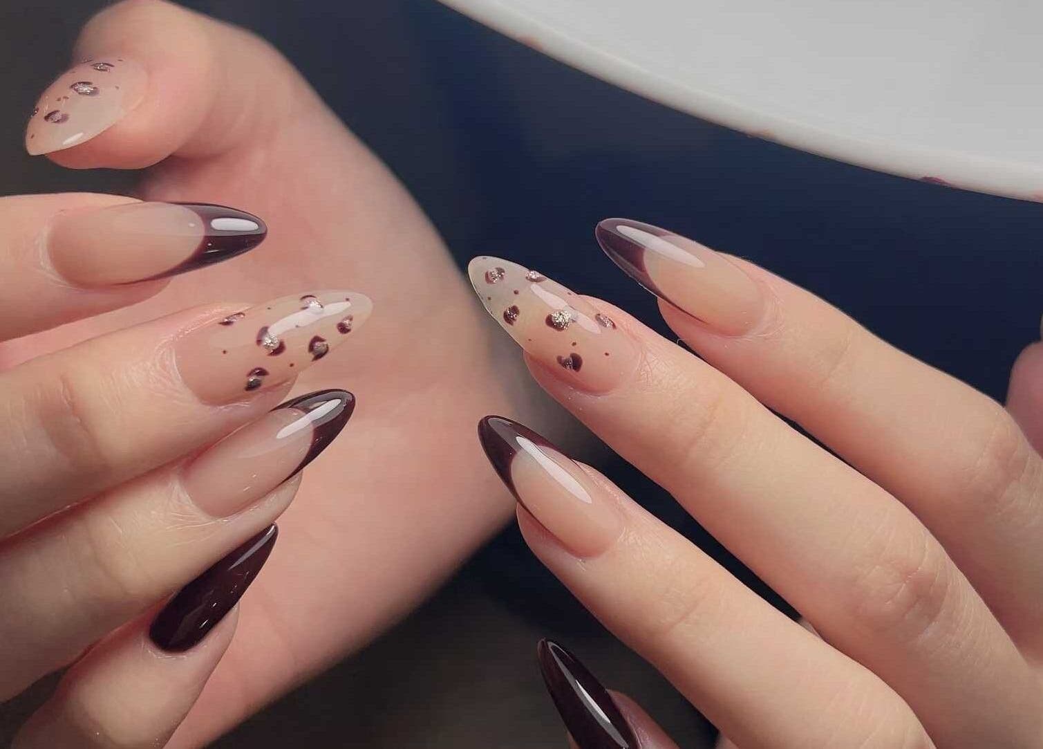 Elegant nail art at Abby Nails Finsbury Park, London, England, GB showcasing glossy tips and floral accents.