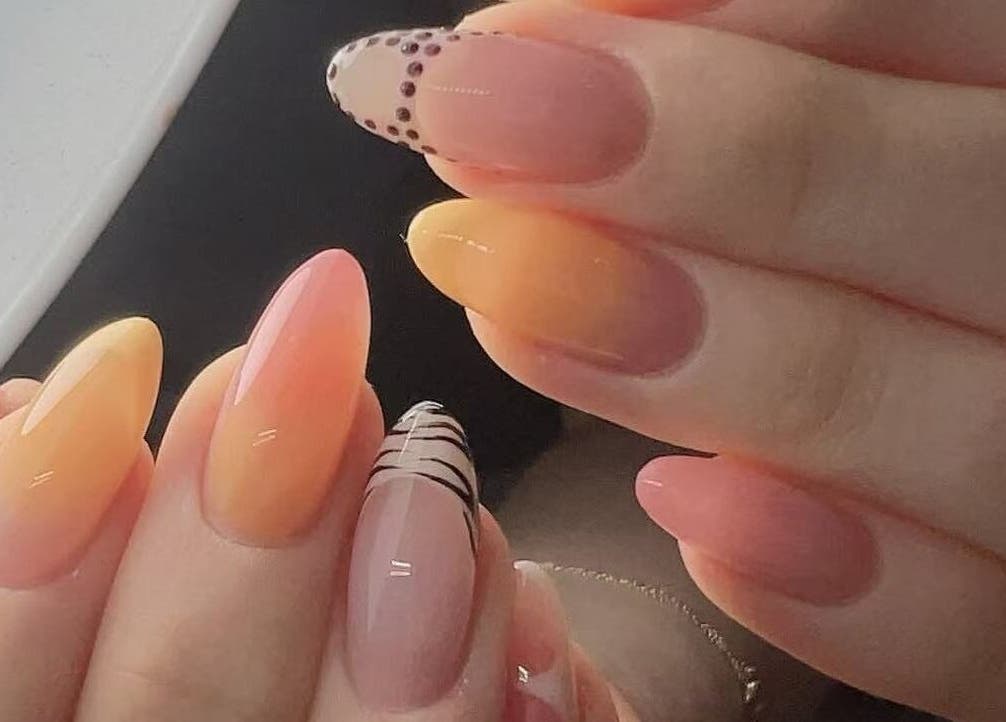 Elegant ombre nails with intricate designs at Abby Nails Finsbury Park, London, England, GB.