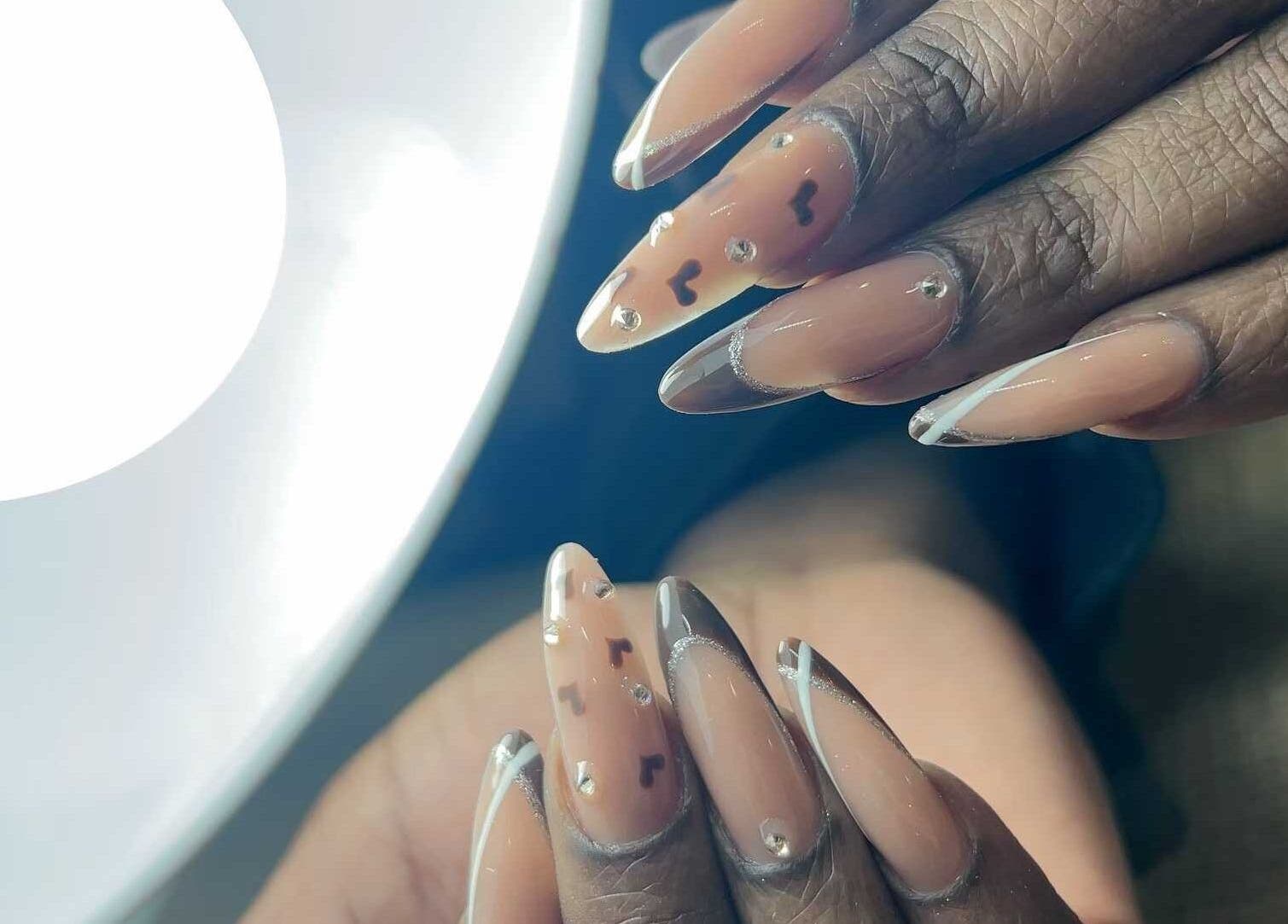 Elegant nail art at Abby Nails Finsbury Park, London, England, GB, featuring delicate designs and embellishments.