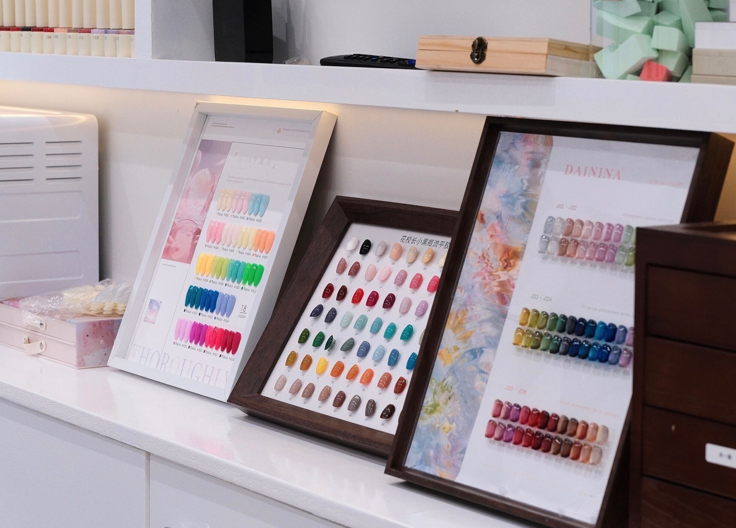 Colorful nail polish palette at Abby Nails Leyton, London, England, GB showcasing a variety of vibrant shades.