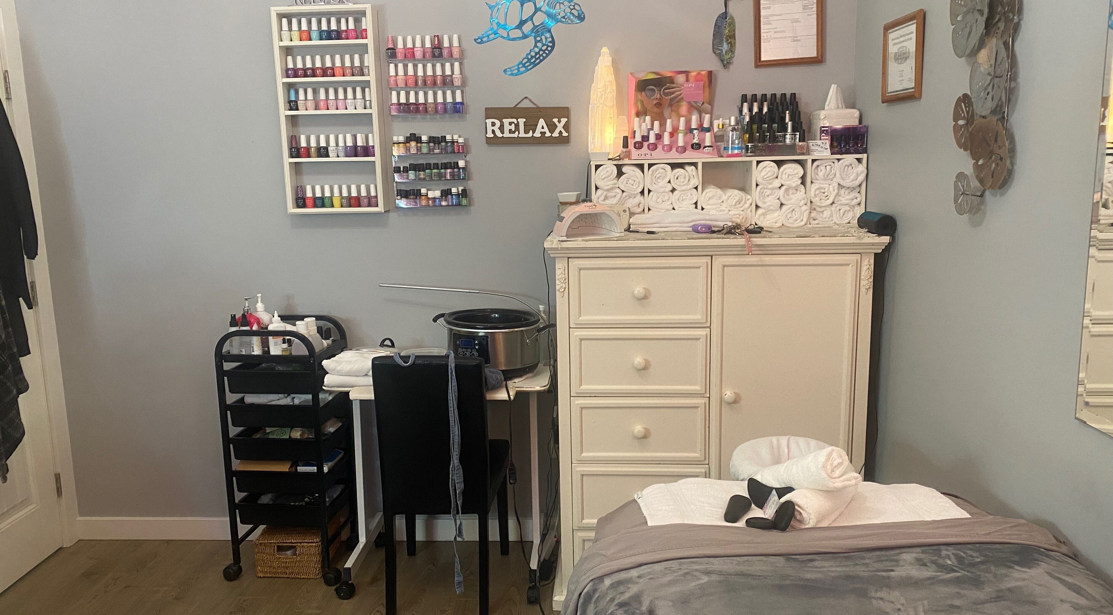 Relaxation setup at Selenite Beauty, Parksville, British Columbia, CA, with nail polish, towels, and serene decor.