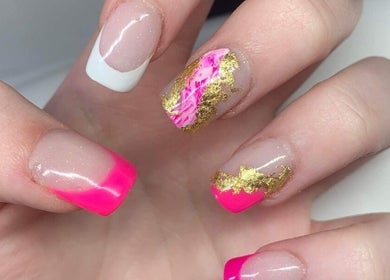 Stylish nail art with vibrant pink and gold designs at The Alchemy Lounge, Blackpool, England, GB.