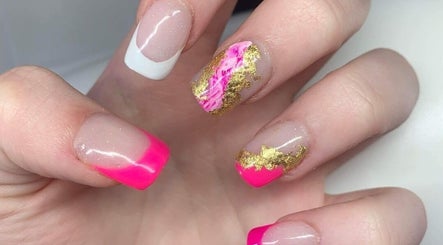 Stylish nail art with vibrant pink and gold designs at The Alchemy Lounge, Blackpool, England, GB.