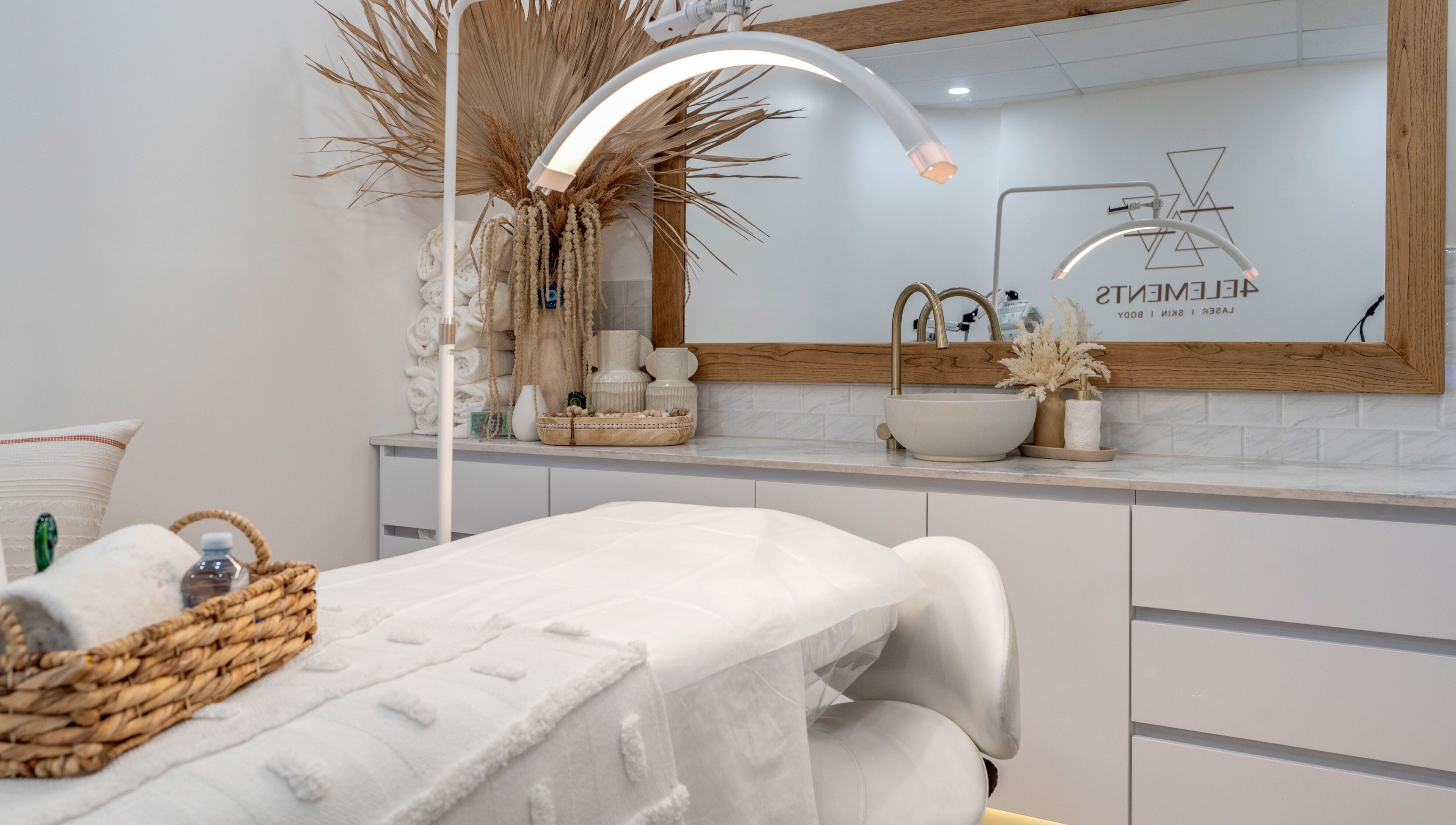Luxurious treatment room at 4 Elements Clinic, Melbourne, Victoria, AU with elegant decor and plush bedding.