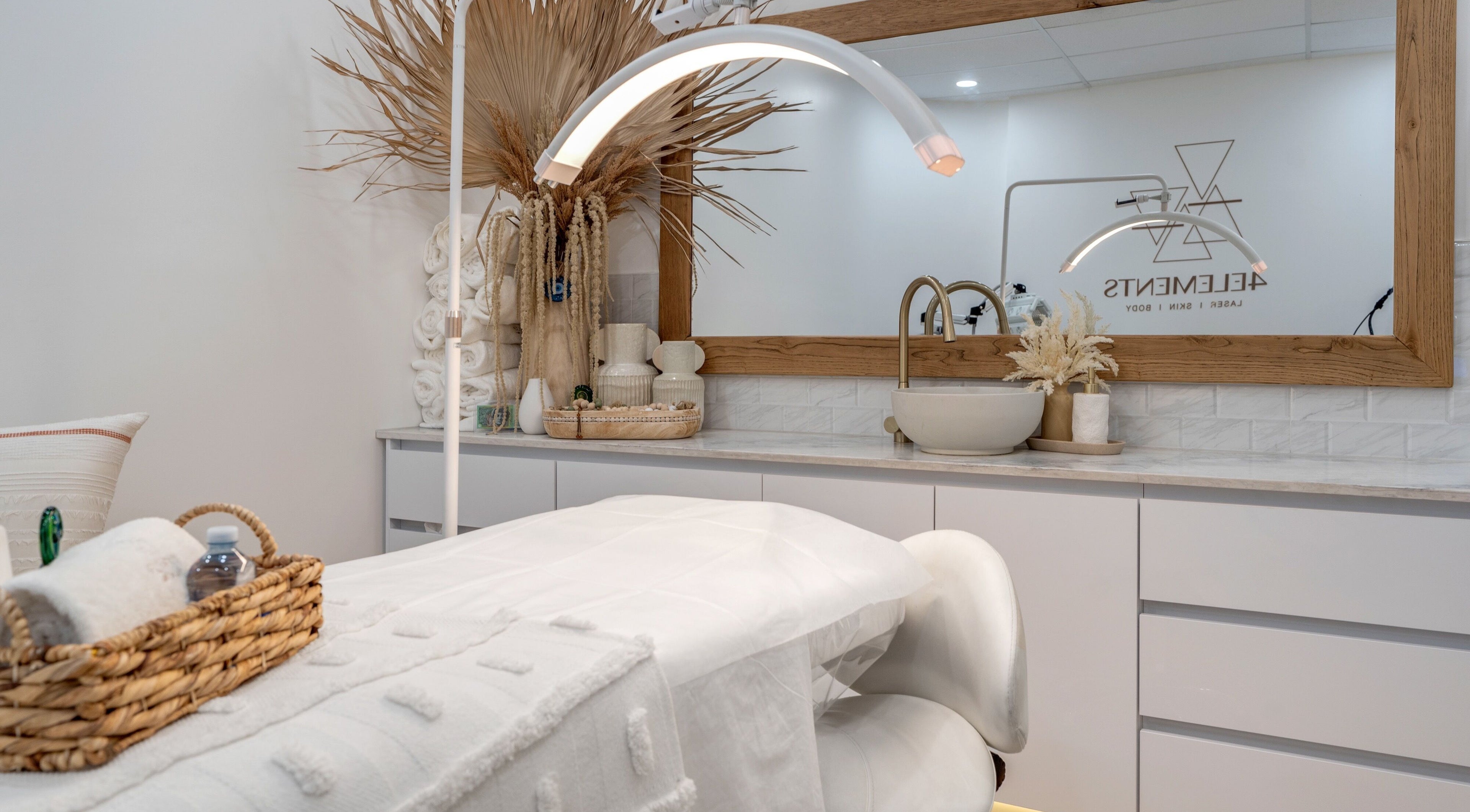 Luxurious treatment room at 4 Elements Clinic, Melbourne, Victoria, AU with elegant decor and plush bedding.