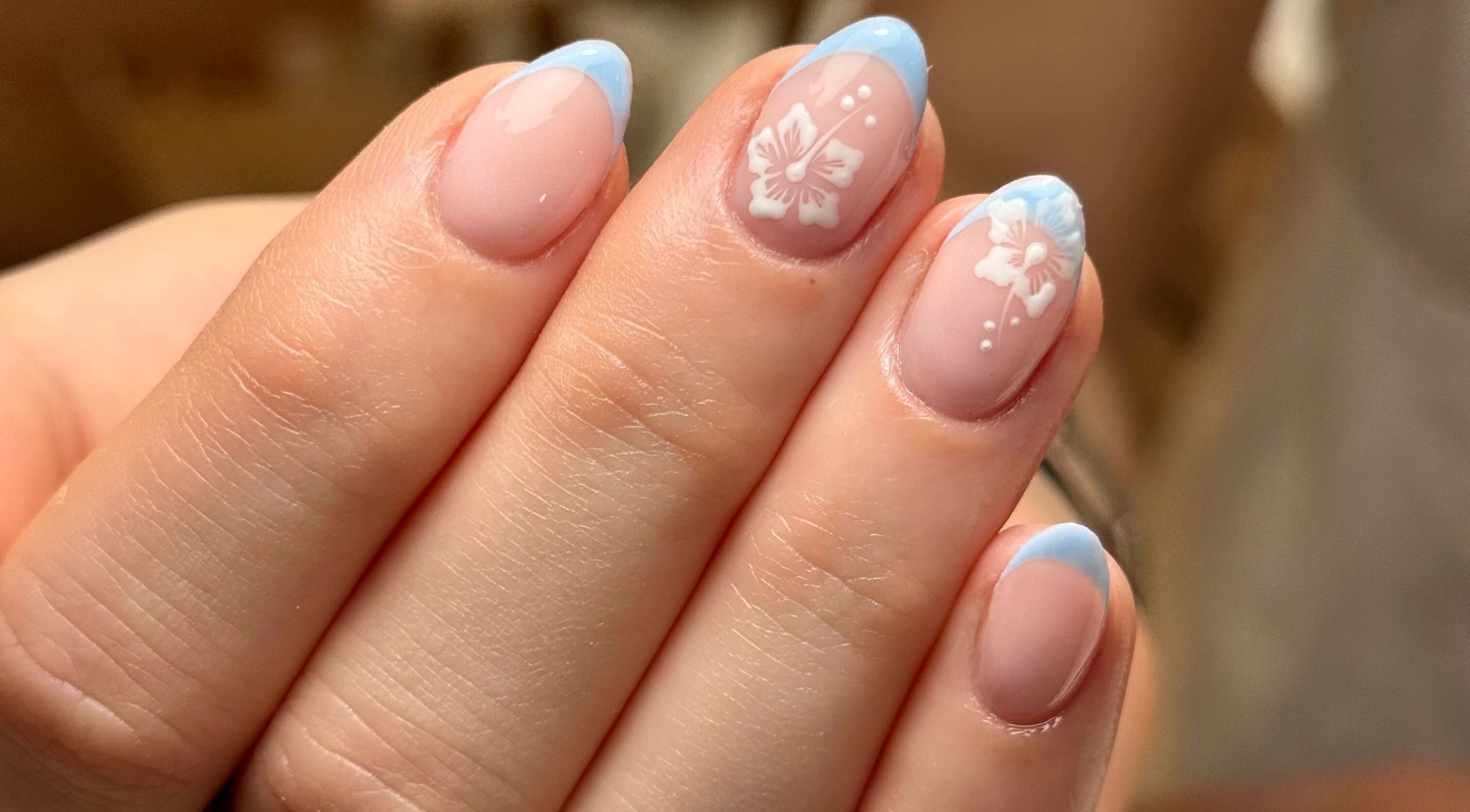 Elegant nail art with pink and blue French tips at Glossed by Holly, Coatbridge, Scotland, GB.