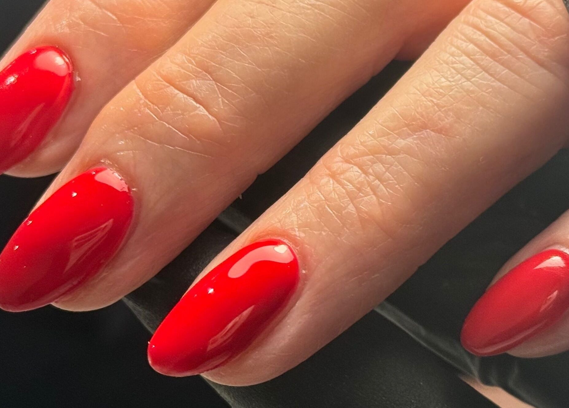 Glossed by Holly manicured red nails, Coatbridge, Scotland, GB. Vibrant color and sleek finish.
