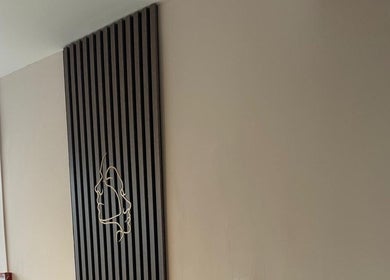 Elegant wall design at Bon Visage Aesthetics Ltd, Shepshed, Loughborough, England, GB. Modern decor with face art.
