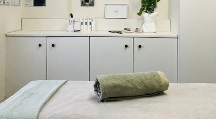 Tranquil treatment room at JustBe Aesthetics Skin Clinic, Cape Town, Western Cape, ZA, featuring a soft bed.