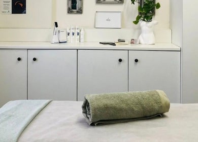 Serene treatment room at JustBe Aesthetics Skin Clinic in Cape Town, Western Cape, ZA, featuring a cozy towel.