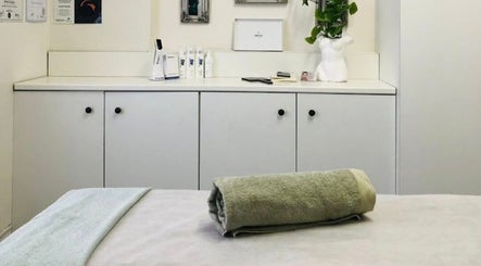 Serene treatment room at JustBe Aesthetics Skin Clinic in Cape Town, Western Cape, ZA, featuring a cozy towel.