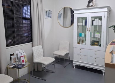 Comfortable seating and product display at JustBe Aesthetics Skin Clinic, Cape Town, Western Cape, ZA.