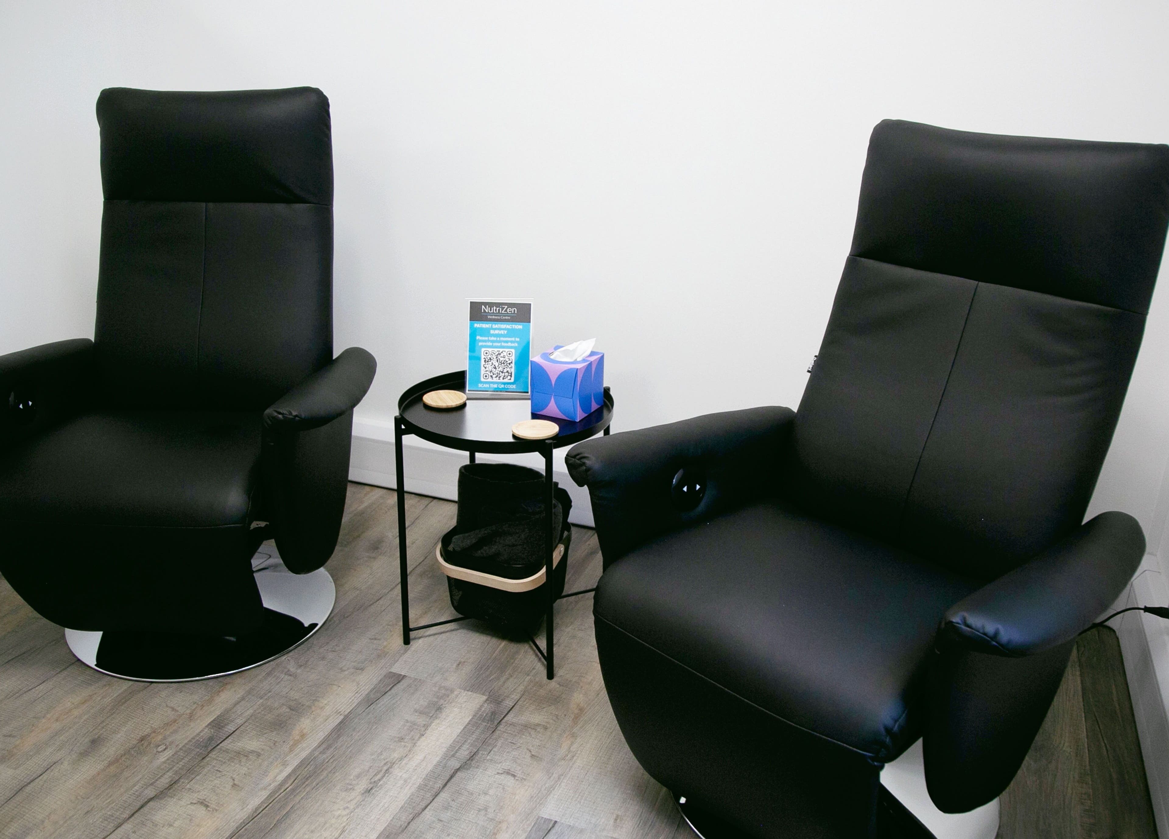 Comfortable black chairs at NutriZen Wellness Centre, Wolverton, England, GB inviting relaxation.