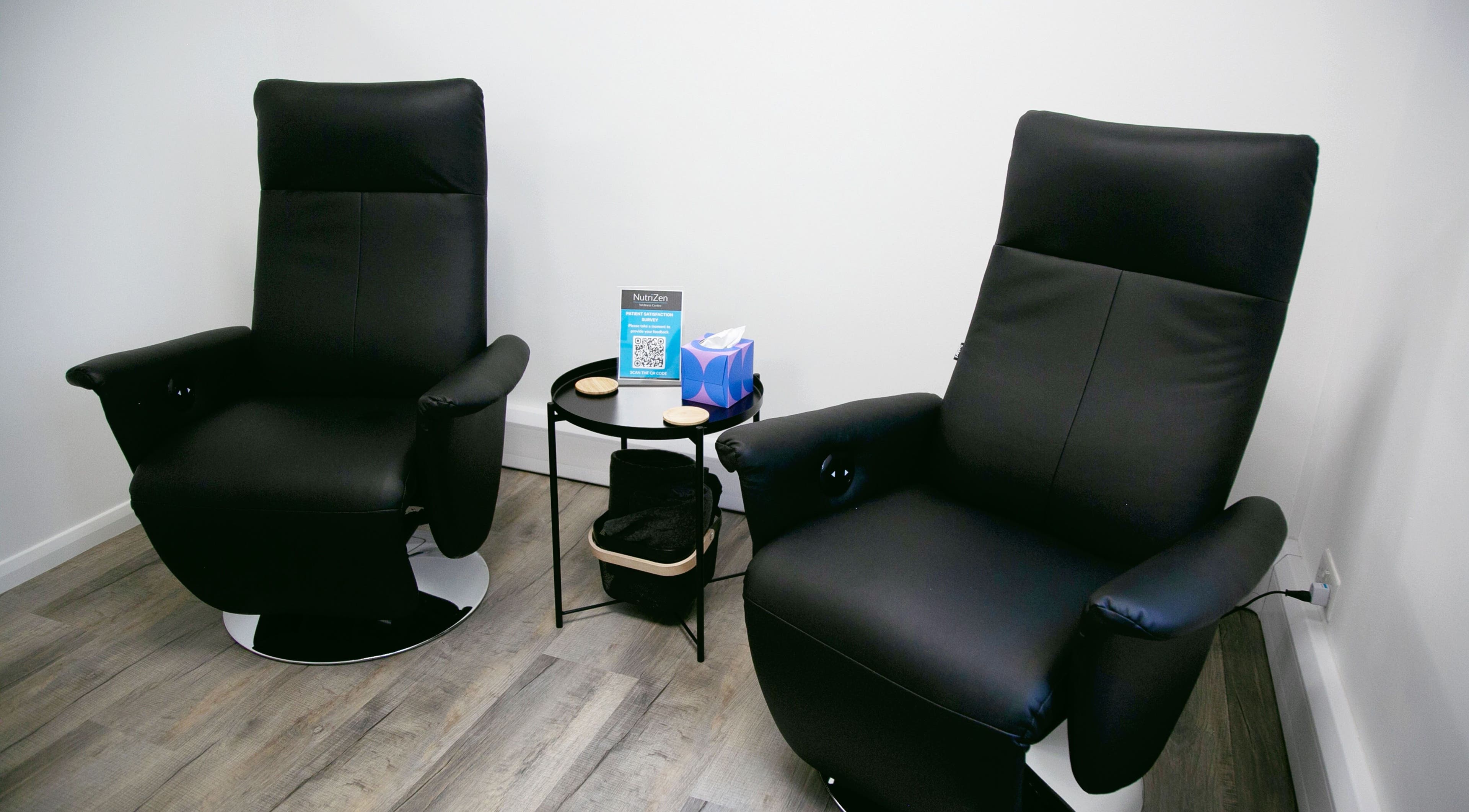 Comfortable black chairs at NutriZen Wellness Centre, Wolverton, England, GB inviting relaxation.