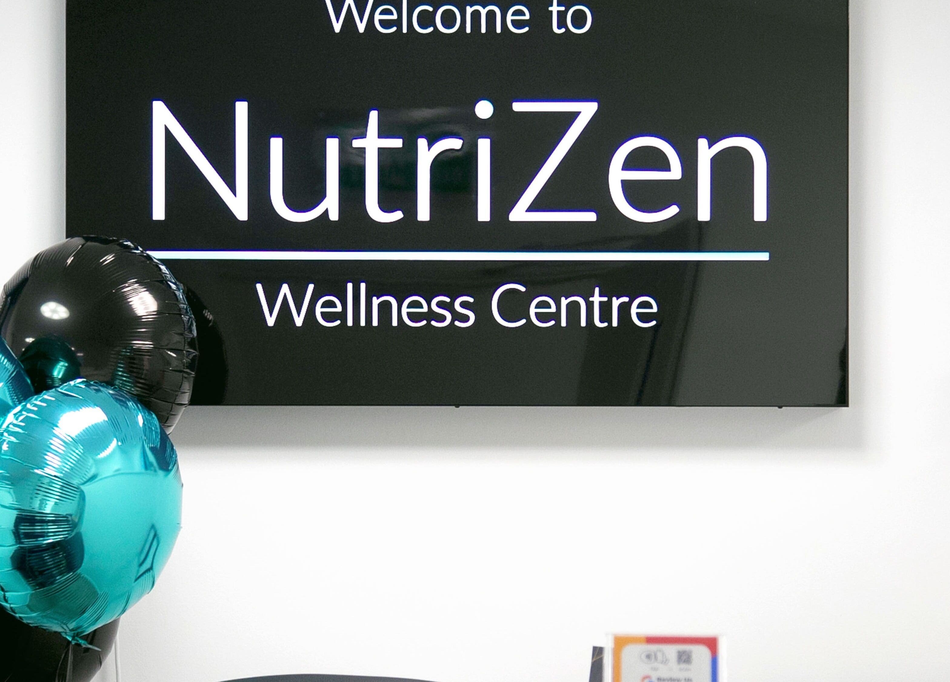 Reception area at NutriZen Wellness Centre with balloons in Wolverton, England, GB.