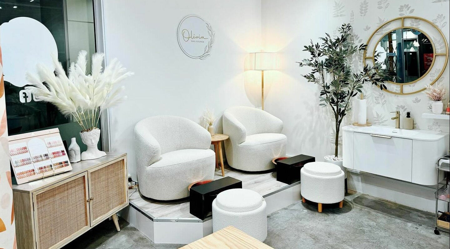 Elegant seating at Olivia Nail Lounge, Wellington, Wellington, NZ, with modern decor and plush chairs.