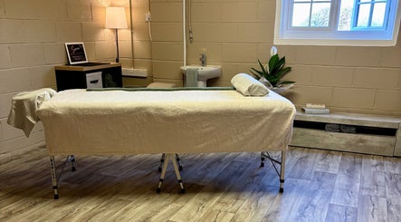 Calm massage room at Serene Massage Therapies, Faversham, England, GB with a treatment bed and relaxing decor.