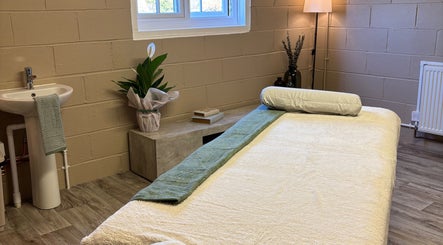 Relaxing massage room at Serene Massage Therapies, Faversham, England, GB with serene ambiance and cozy setup.