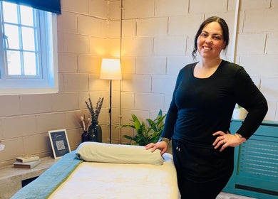 Relaxing massage room at Serene Massage Therapies, Faversham, England, GB with welcoming therapist.