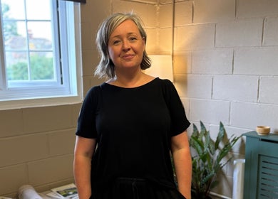 A serene practitioner at Serene Massage Therapies, Faversham, England, GB, in a peaceful wellness room.