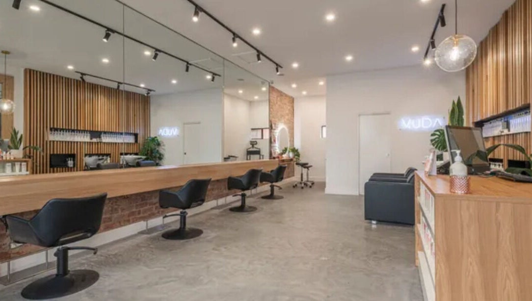 Elegant interior of Vuda salon in Melbourne, Victoria, AU with modern chairs and stylish decor.
