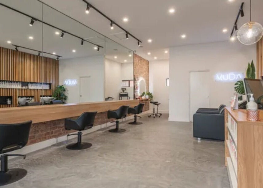 Elegant interior of Vuda salon in Melbourne, Victoria, AU with modern chairs and stylish decor.