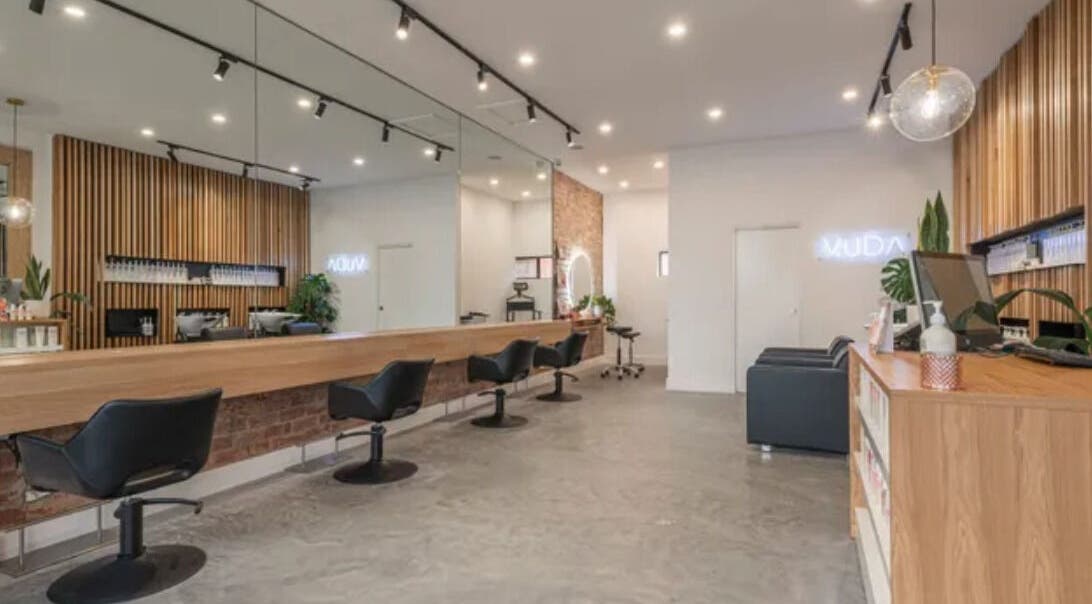 Elegant interior of Vuda salon in Melbourne, Victoria, AU with modern chairs and stylish decor.