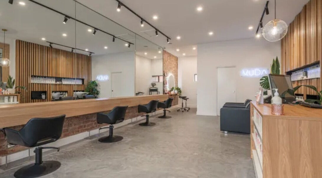 Elegant interior of Vuda salon in Melbourne, Victoria, AU with modern chairs and stylish decor.