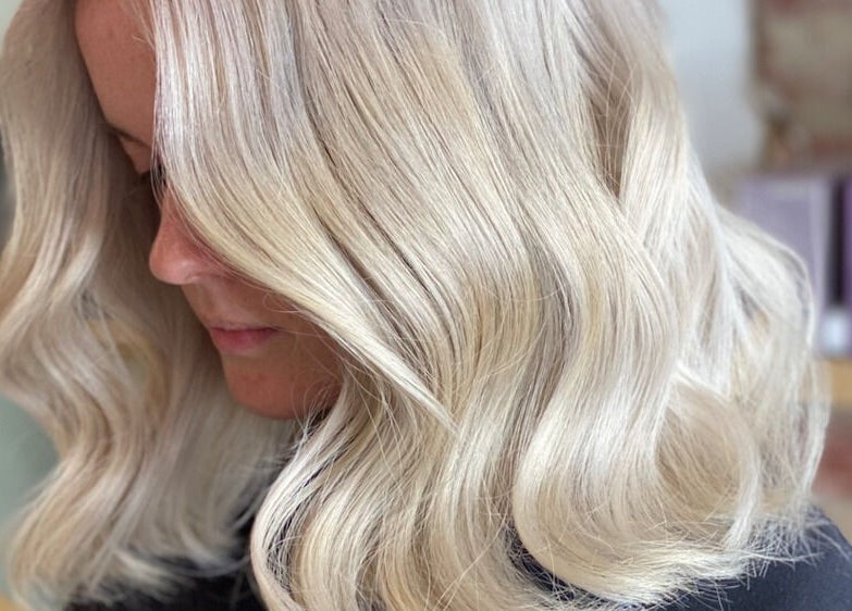 Silky blonde waves styled at Vuda, Melbourne, Victoria, AU. Perfectly crafted for a radiant look.