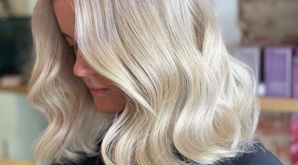 Silky blonde waves styled at Vuda, Melbourne, Victoria, AU. Perfectly crafted for a radiant look.